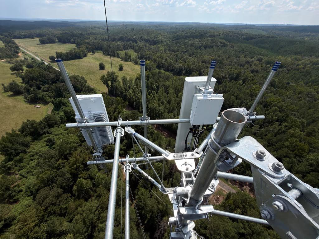 New Verizon 5G antennas installed on a tower mount above the forest