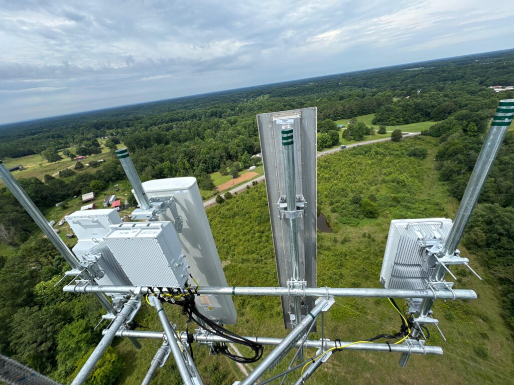 Tower Tigers Crew technician completing a Verizon antenna installation on a tower in Alabama